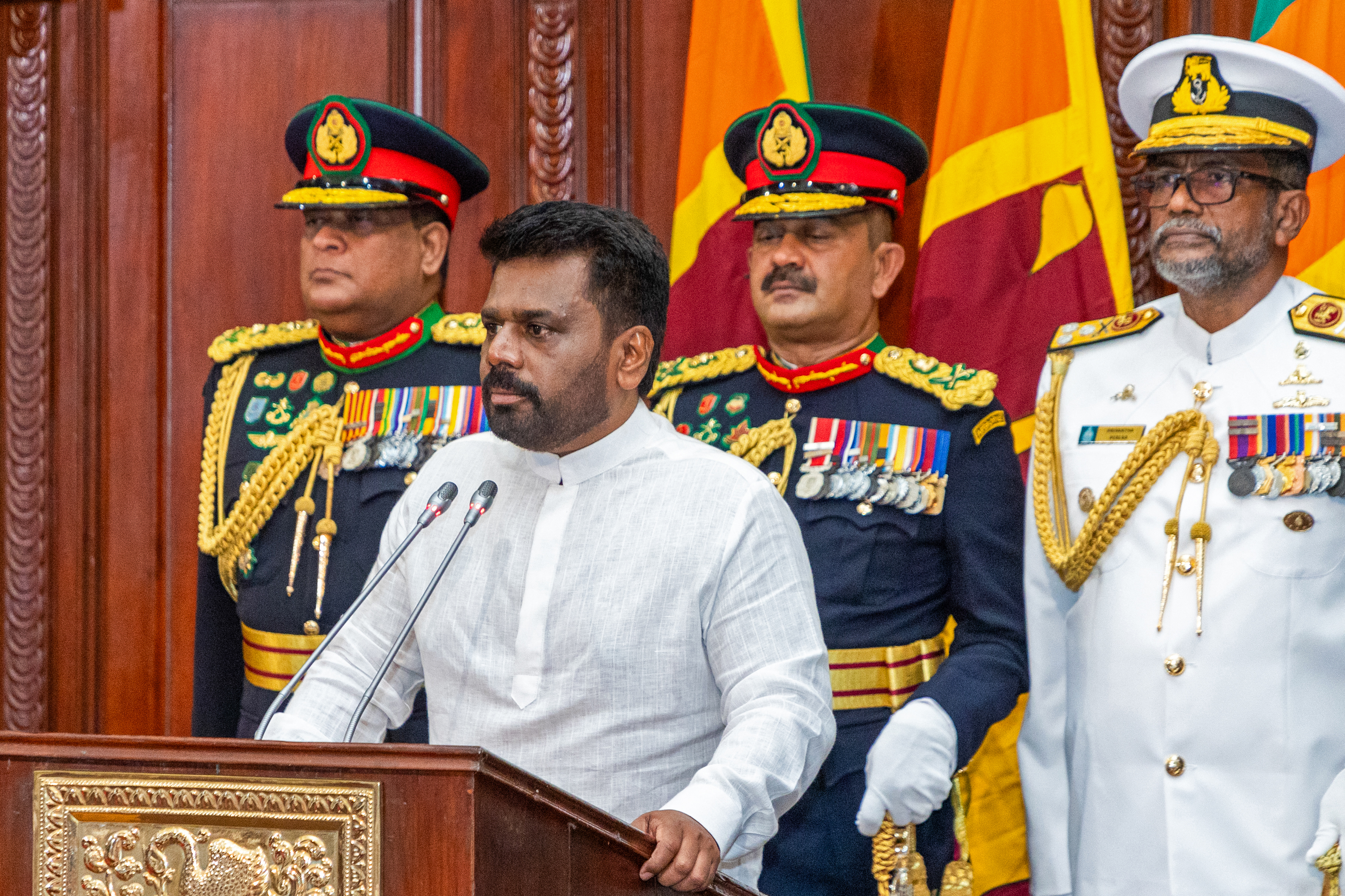 This handout photograph taken and released by the Sri Lanka President's Office on September 23, 2024 shows Sri Lanka's new President Anura Kumara Dissanayaka attending his swearing-in ceremony, in Colombo. - Sri Lanka's first leftist president was sworn in to office on September 23 vowing to restore public faith in politics but said he had no magic solution to the hardships suffered following an unprecedented economic crisis. (Photo by Sri Lanka President's Office / AFP) / RESTRICTED TO EDITORIAL USE - MANDATORY CREDIT "AFP PHOTO/SRI LANKA PRESIDENT'S OFFICE" - NO MARKETING NO ADVERTISING CAMPAIGNS - DISTRIBUTED AS A SERVICE TO CLIENTS